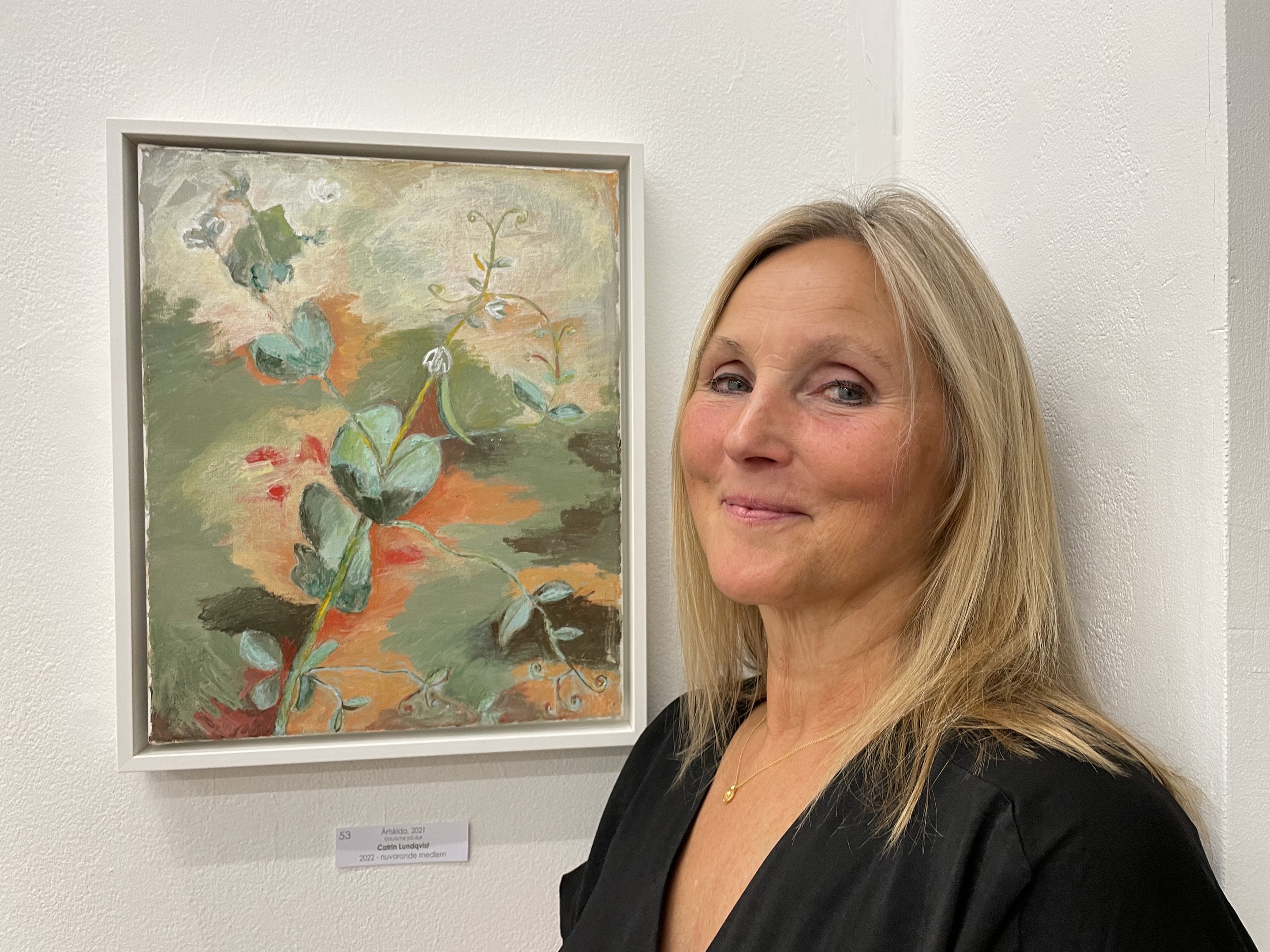 Pea pd Plant, 2023. Framed and the artist Catrin Lundqvist at a member's exhibition at Studio 44 in Stockholm, 2023.